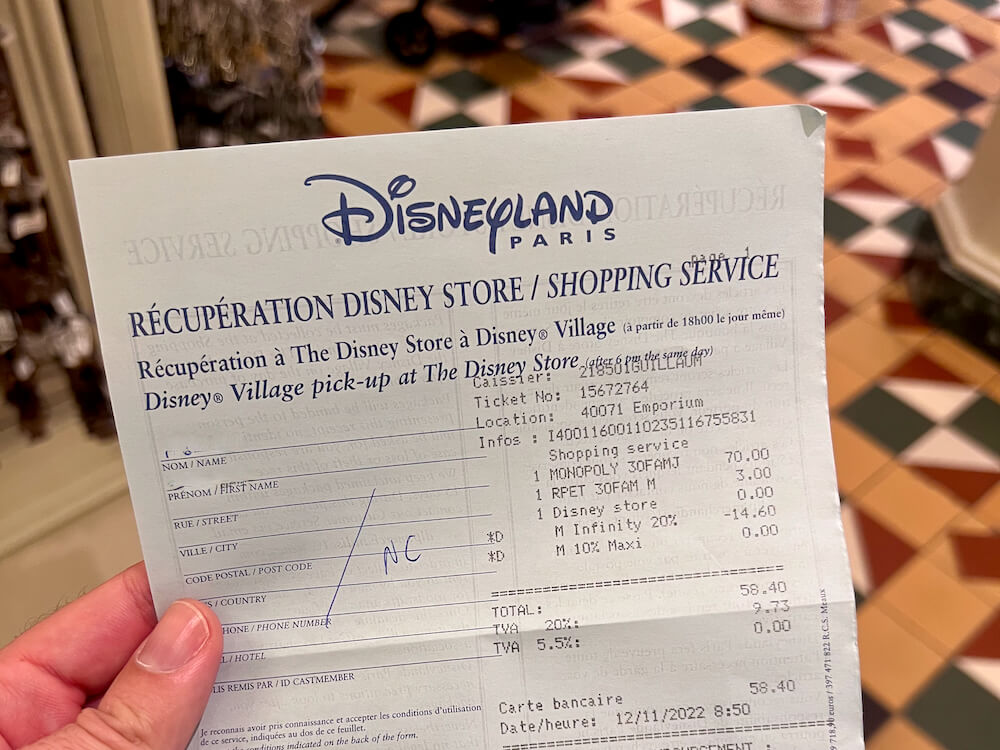 Recibo de servicio de recogida de compras de las tiendas de Disneyland Paris